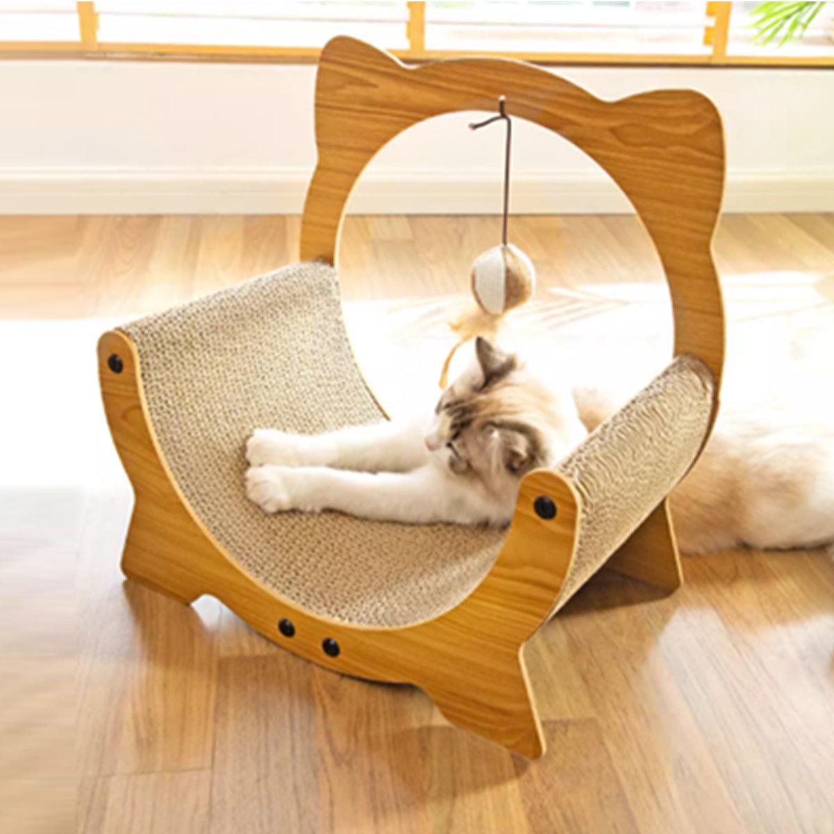 Cat scratching on a wooden cat bed scratcher with a hammock and hanging toy.