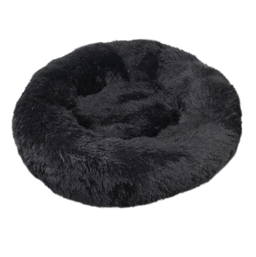 Black fluffy donut pet bed on a white background