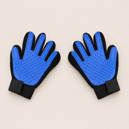 A pair of pet grooming gloves with bright blue textured silicone pads on the palms and black fabric backs and wrist straps, displayed on a light beige background.