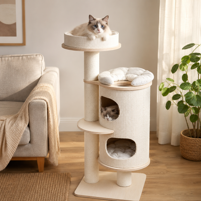 A cream-colored cat tree with sisal-wrapped posts and multiple levels, shown in a bright living room with two cats resting inside and on the top platform. The scene includes a sofa, curtains, and a potted plant.