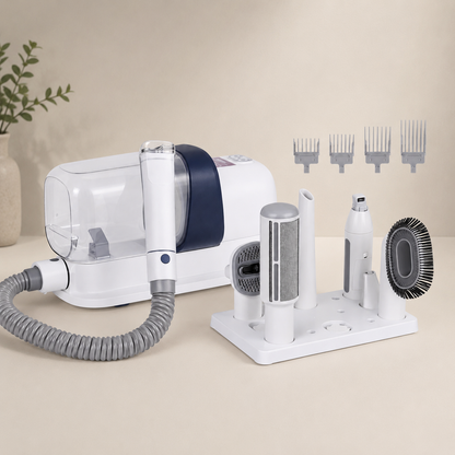 Pet grooming vacuum with clipper and brush on a beige background