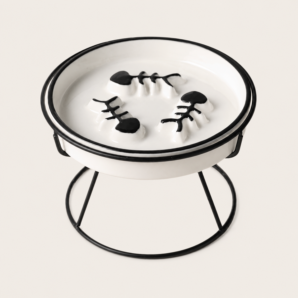 Black and white cat feeding bowl sitting in a black iron stand