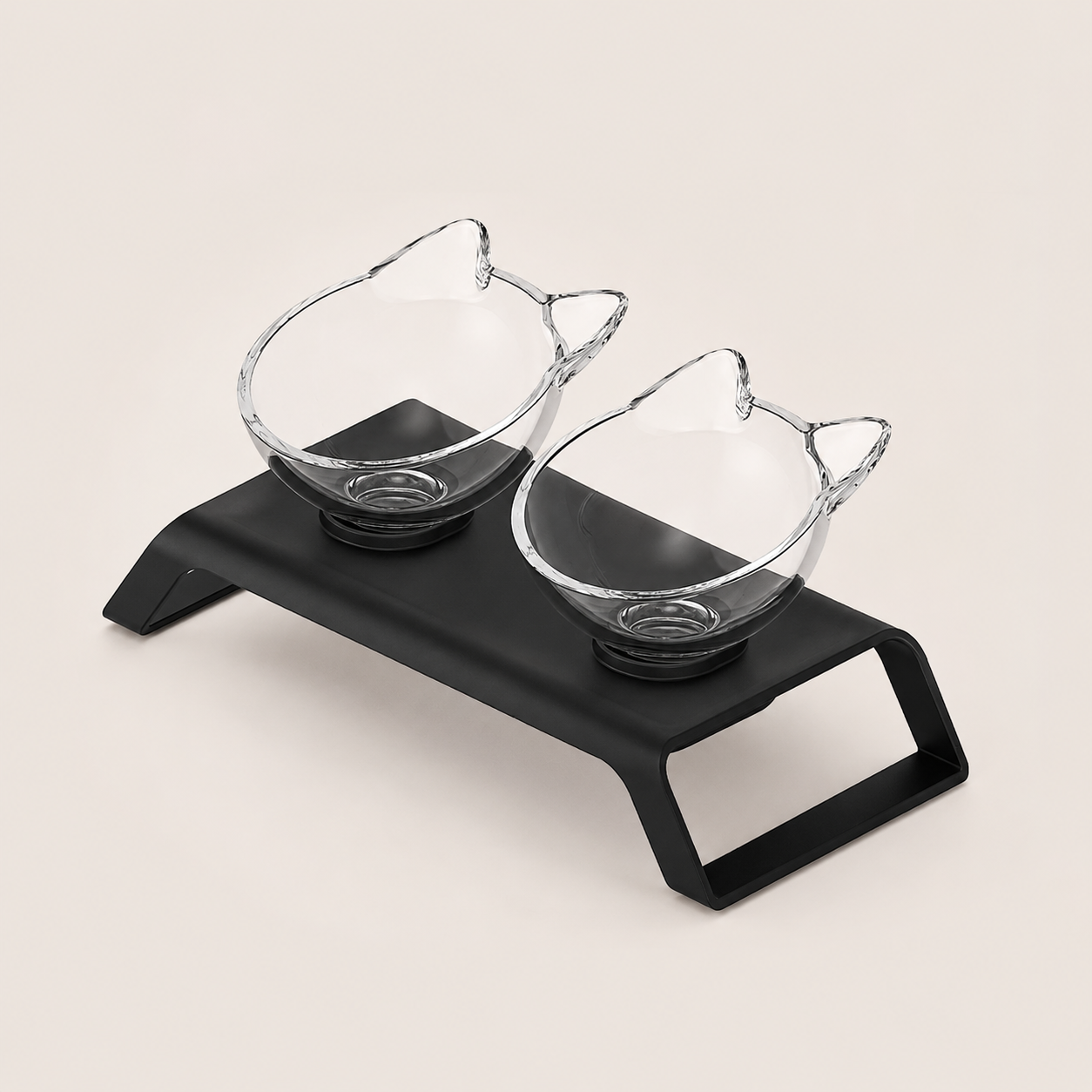 Cat-shaped plastic bowls on a black tray with a white background