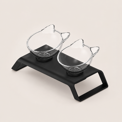 Cat-shaped plastic bowls on a black tray with a white background