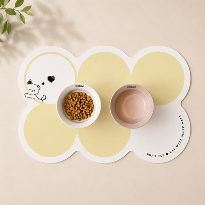 Pet Feeding Mat in yellow and white with a food and water bowl sitting on it
