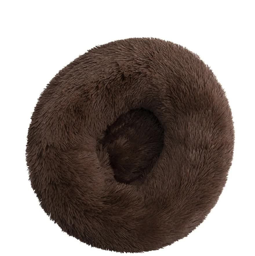 Brown fluffy donut-shaped pet bed on a white background