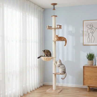 Beige cat tree with multiple levels in a room with light blue walls and white curtains.