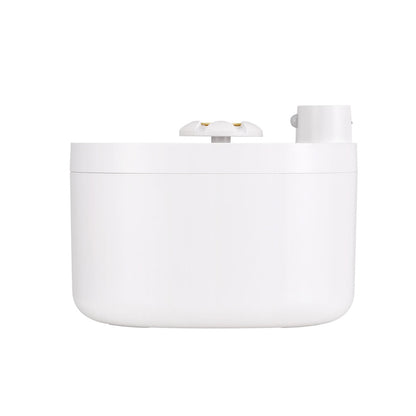 White cylindrical container with lid on a white background
