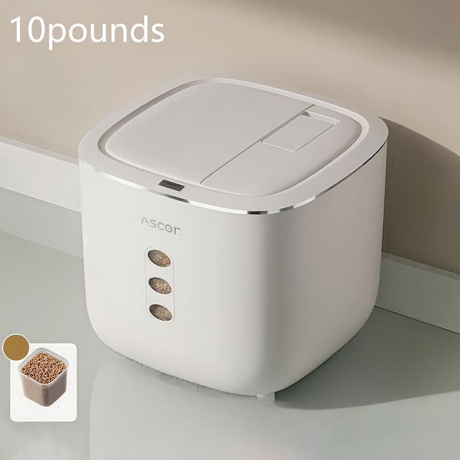 White pet food container with '10 pounds' label and Ascot branding on a neutral background.