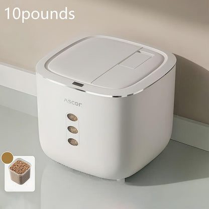 White pet food container with '10 pounds' label and Ascot branding on a neutral background.