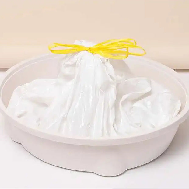 White drawstring bag with yellow string in a white bucket against a beige background