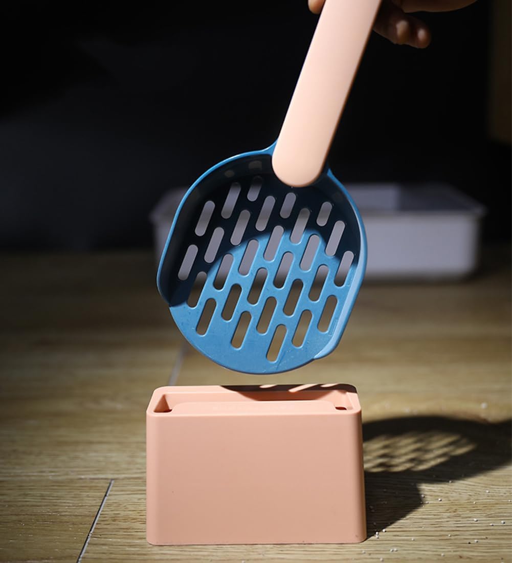 Blue scoop with beige handle on a beige base against a dark background