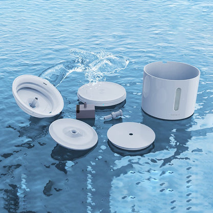 Cat smart water fountain with various components on water