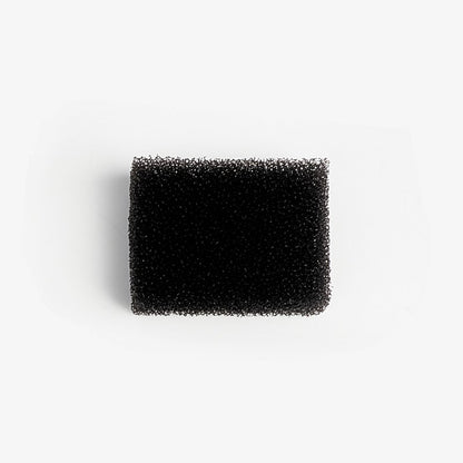 Black rectangular foam filter on a white background