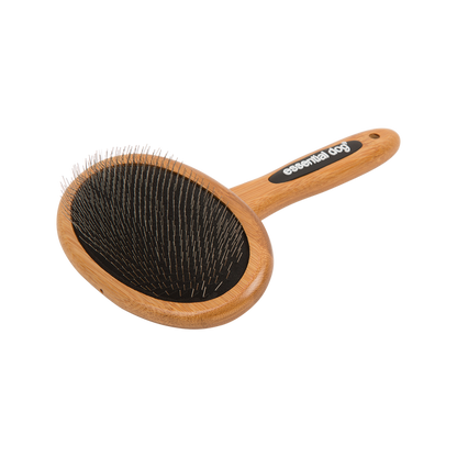 Pet grooming brush with wooden handle and black bristles on a white background