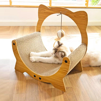 Cat scratching on a wooden cat bed scratcher with a hammock and hanging toy.