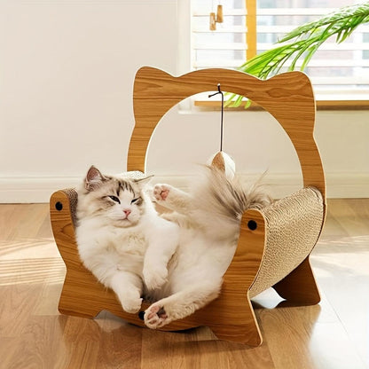 Cat lying on a wooden cat-shaped hammock scratching post with hanging ball indoors.