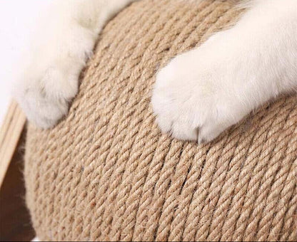Cat paws on a rope scratcher with text about solid wood hemp rope.