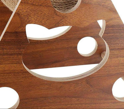Wooden cat scratcher with cat shaped cut-outs on a wooden surface
