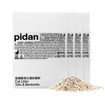 Cat litter - tofu and bentonite - packaging with visible text and a small pile of cat litter on a white background
