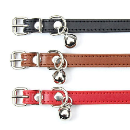 Three leather cat collars in black, brown, and red with metal buckles on a white background.