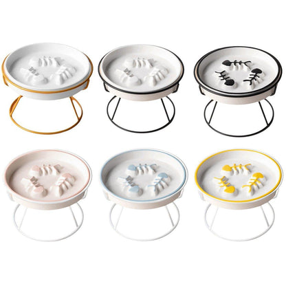Six cat bowls on stands with decorative fish pattern on a white background