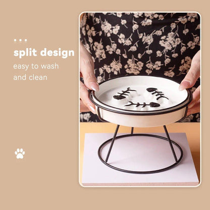 Person holding an elevated cat bowl with floral patterned top, on a beige background.