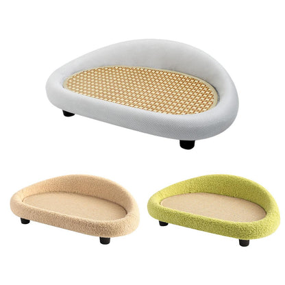 Three pet beds / scratch mats in different colours on a white background