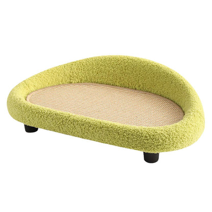 Green pet bed with a beige scratch mat on a white background
