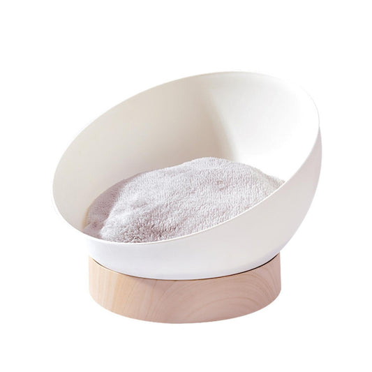 White and beige pet bed with a soft pillow on a white background
