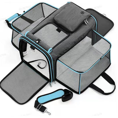 Cat carrier with blue accent, expandable sections and a shoulder strap on a white background