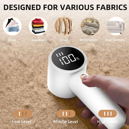 Handheld electric pet hair remover with digital display on a fabric background, indicating its use for various fabrics.