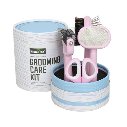 Pet grooming care kit with pink tools including scissors, brushes, and a container labelled 'HistoTree' on a white background.
