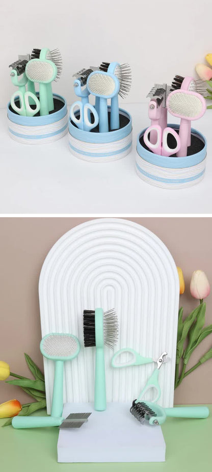 Set of cat grooming tools and accessories on a white arch with flowers in the background.