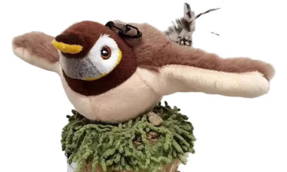 Plush bird toy with a green base on a white background