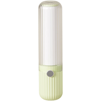 Green and white lint roller on a white background
