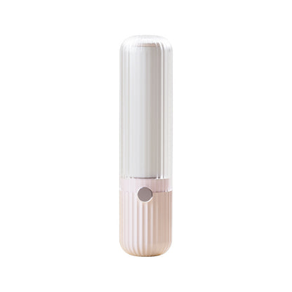 White and pink lint roller on a white background