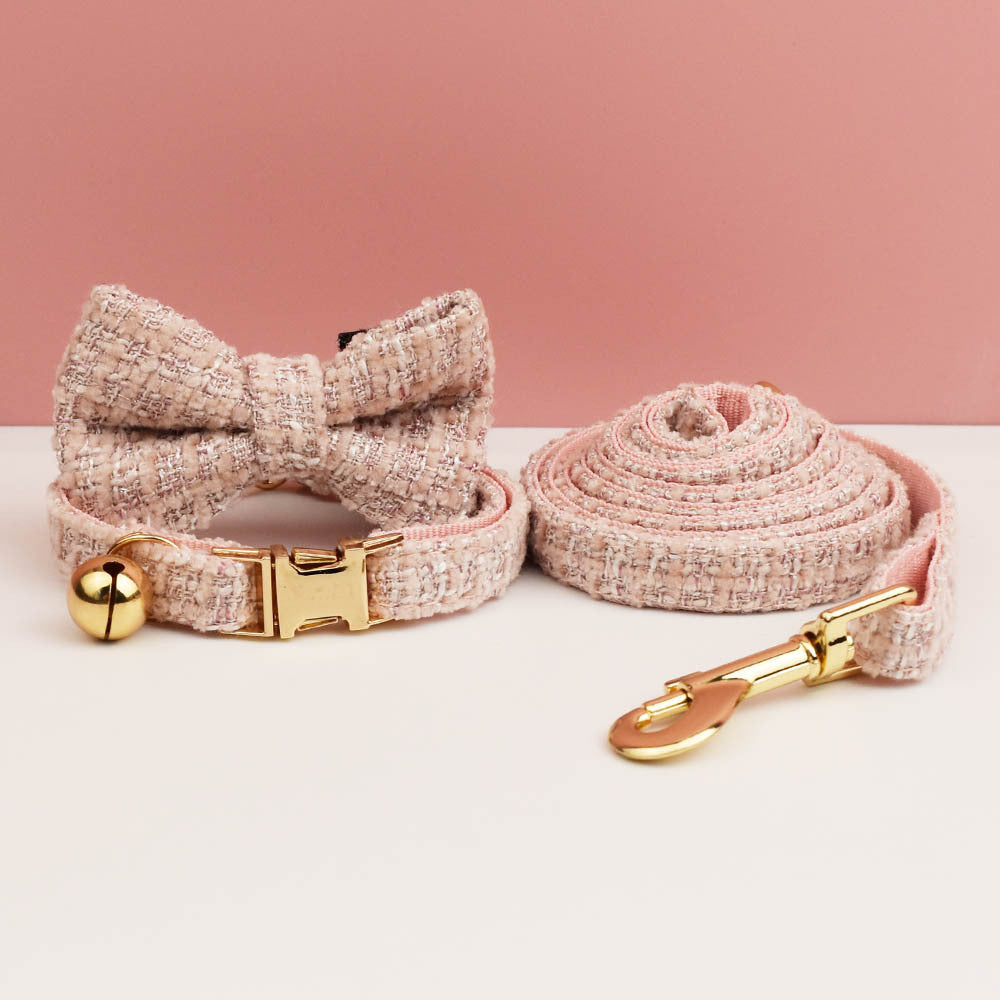 Cat collar and leash set with a bow tie design on a pink background