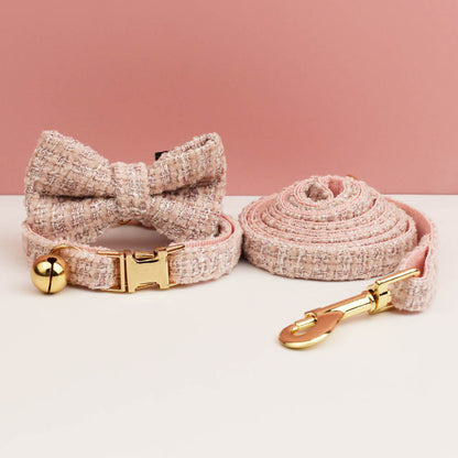 Cat collar and leash set with a bow tie design on a pink background