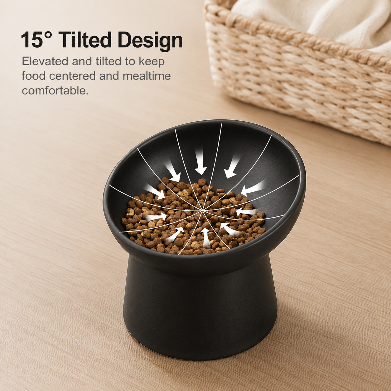 Black elevated pet food bowl on a light wood surface with text reading '15° Tilted Design' and arrows showing the tilted bowl design. A woven basket is blurred in the background.
